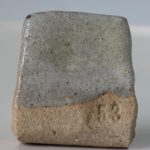 Bubbly, opaque, gray coverall. Hides pretty much anything that's underneath.